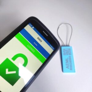 Smartphone scanning RFID security seal tag showing locked status